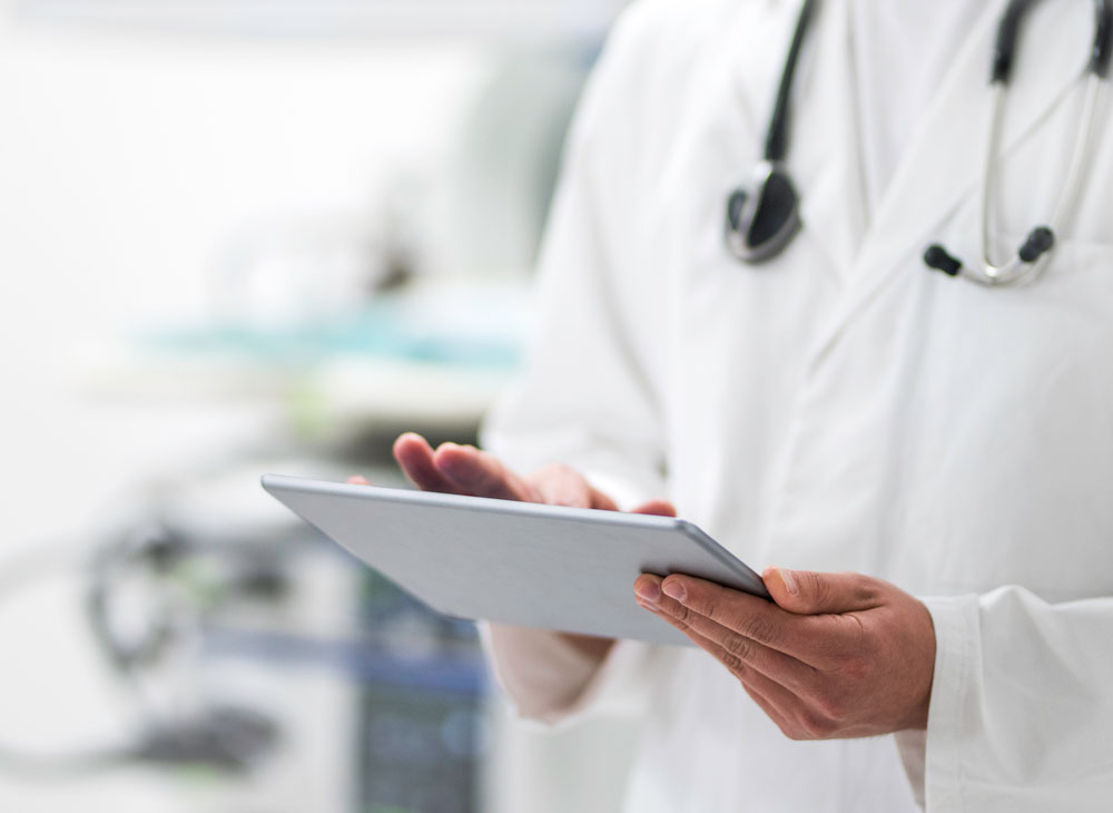 Medical professional using a tablet