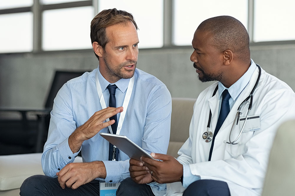 Two medical professionals talking to each other